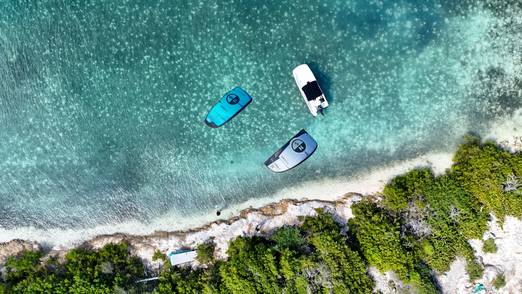 Kitesurfing in turquoise Caribbean waters near Antigua's tropical coastline