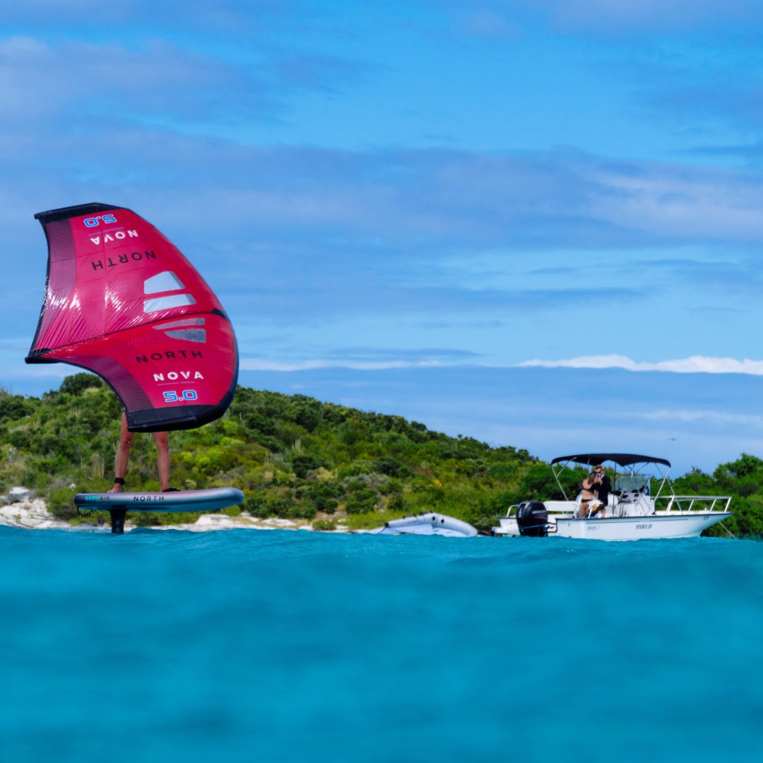 Wing foiling lesson in clear Caribbean water near Antigua beach
